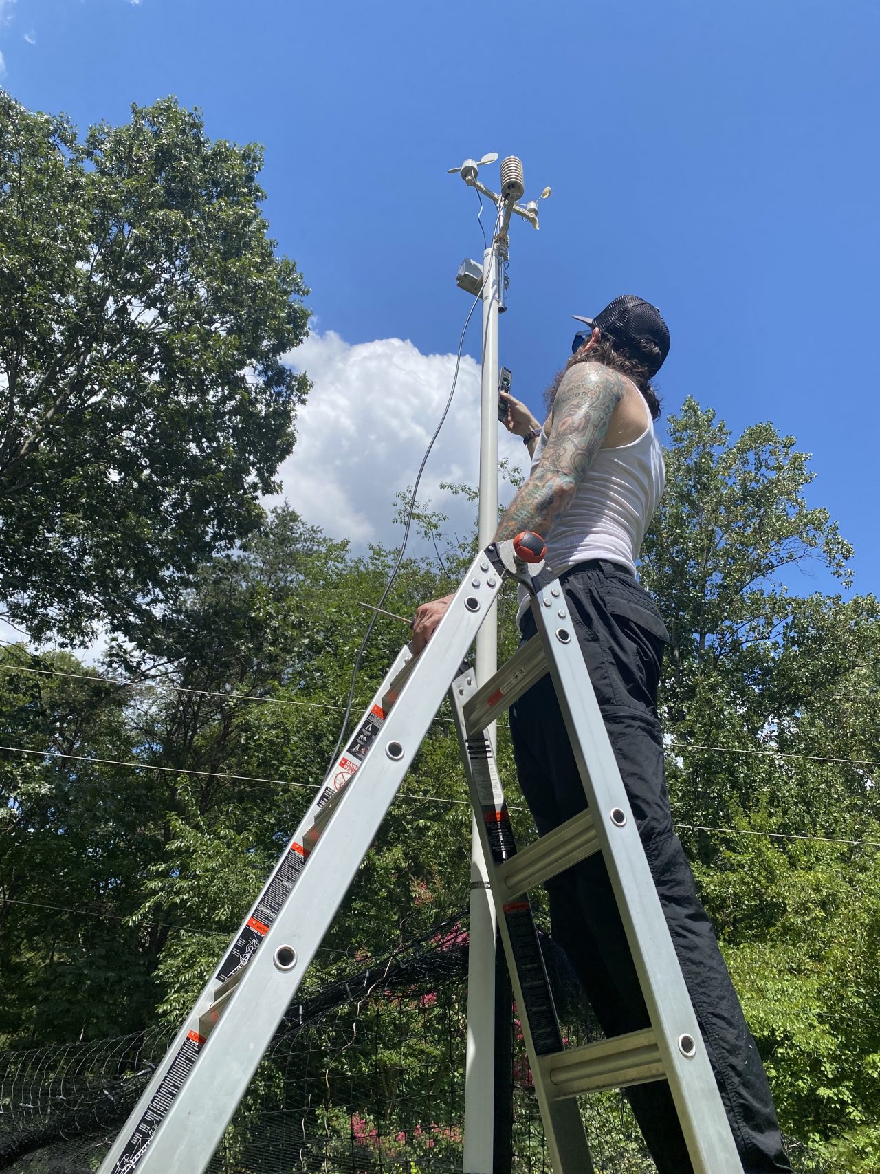 The author’s deployment partner checking to see if the PVC is plumb using a bubble level